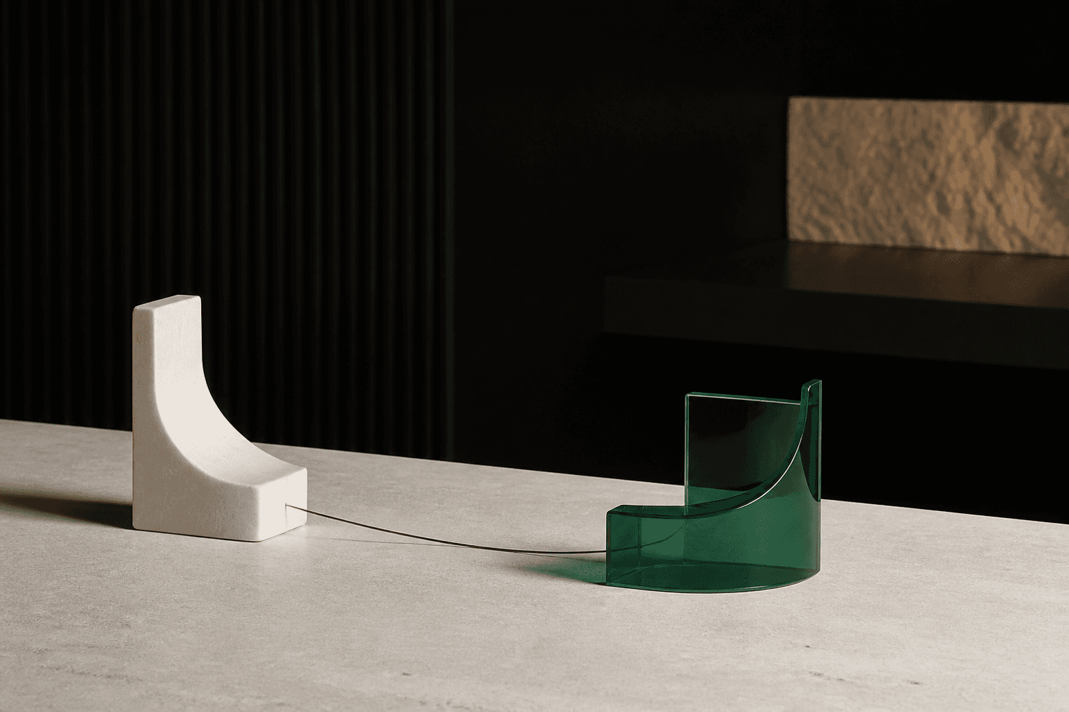 Ivory and emerald sculptural forms connected across a table